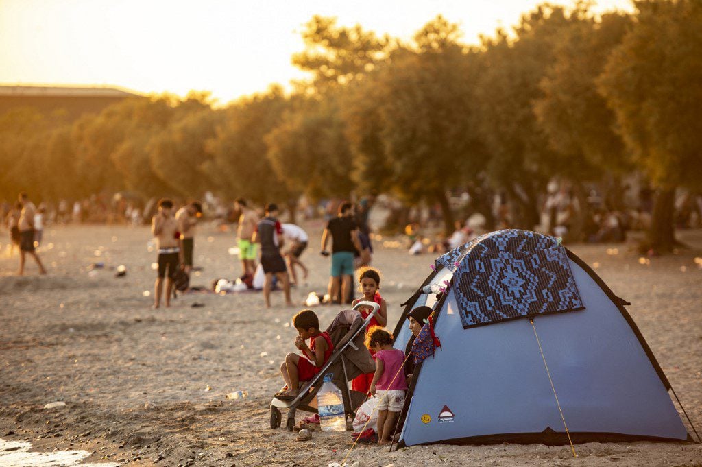 A Syrian family is seen in a tent on the beach at Menekse in Istanbul