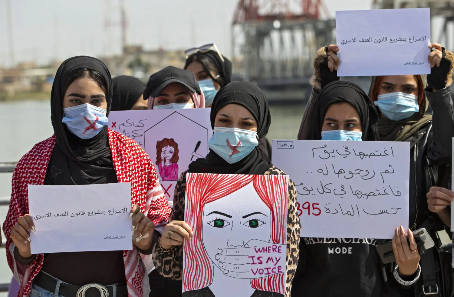 Demonstrators wearing cross-out masks attend a rally for International Women's Day in Iraq.